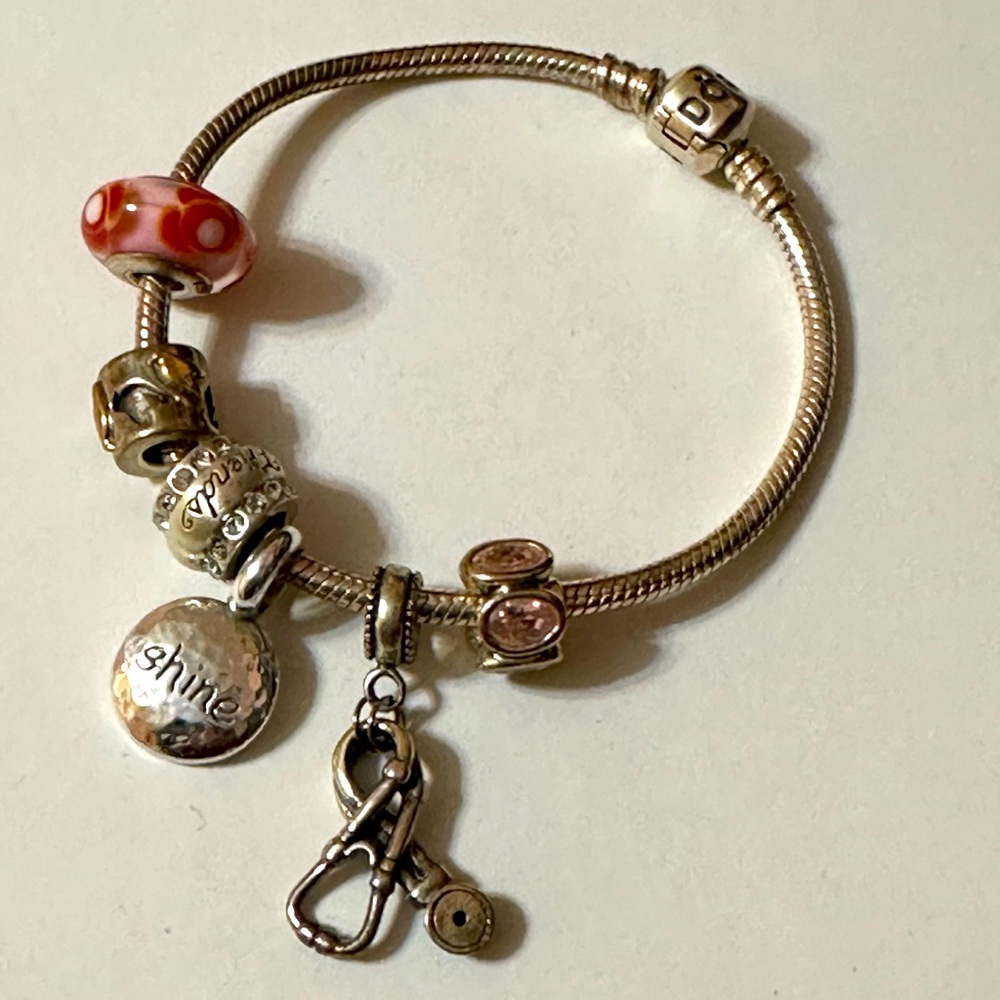 Pandora bracelet with a few bobbles.